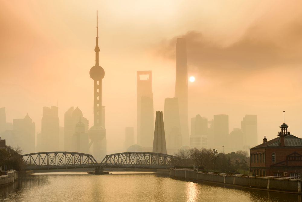 Shanghai,Financial,Center,And,Modern,Skyscraper,City,In,Misty,Gold