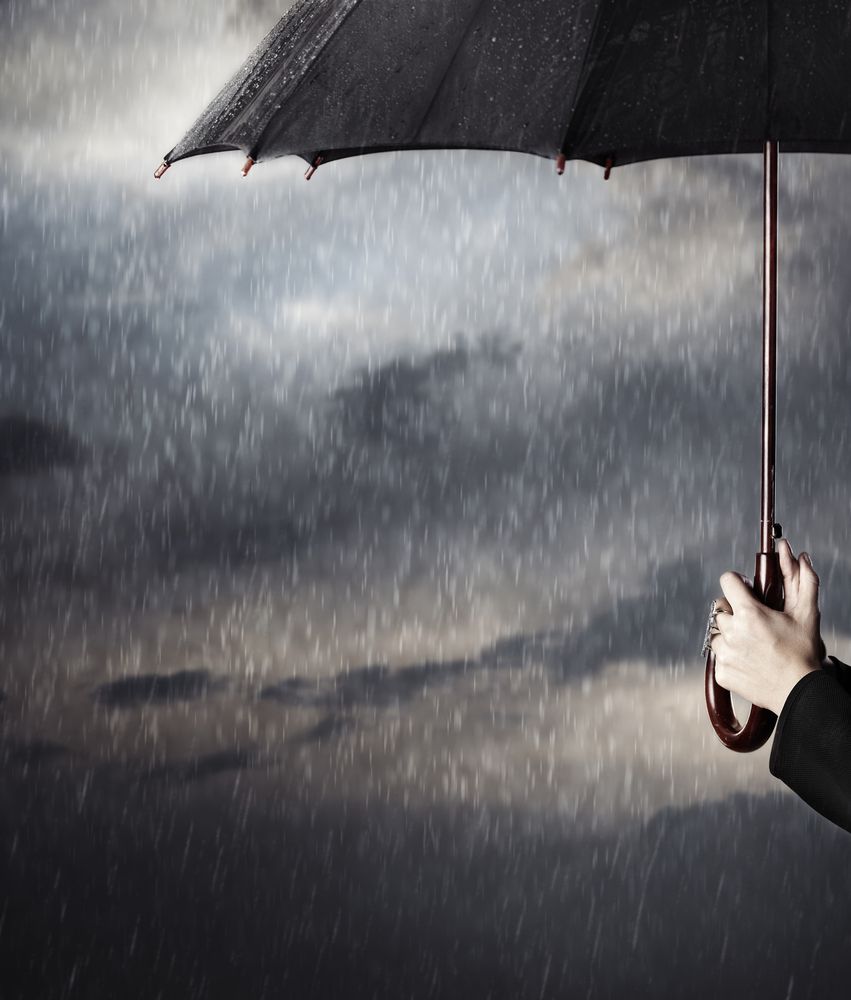 Human,Hands,Holding,Big,Black,Umbrella,Under,The,Heavy,Rain