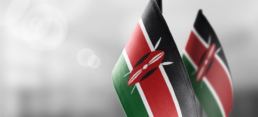 Small,National,Flags,Of,The,Kenya,On,A,Light,Blurry