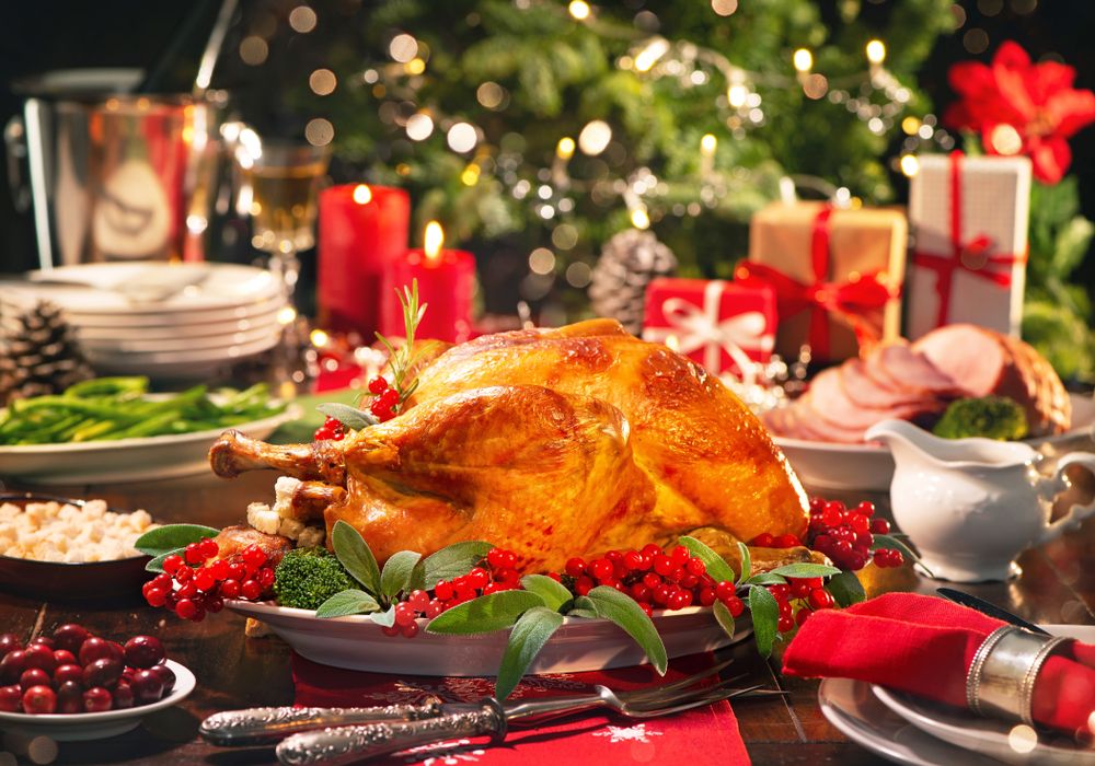 Christmas,Turkey,Dinner.,Baked,Turkey,Garnished,With,Red,Berries,And