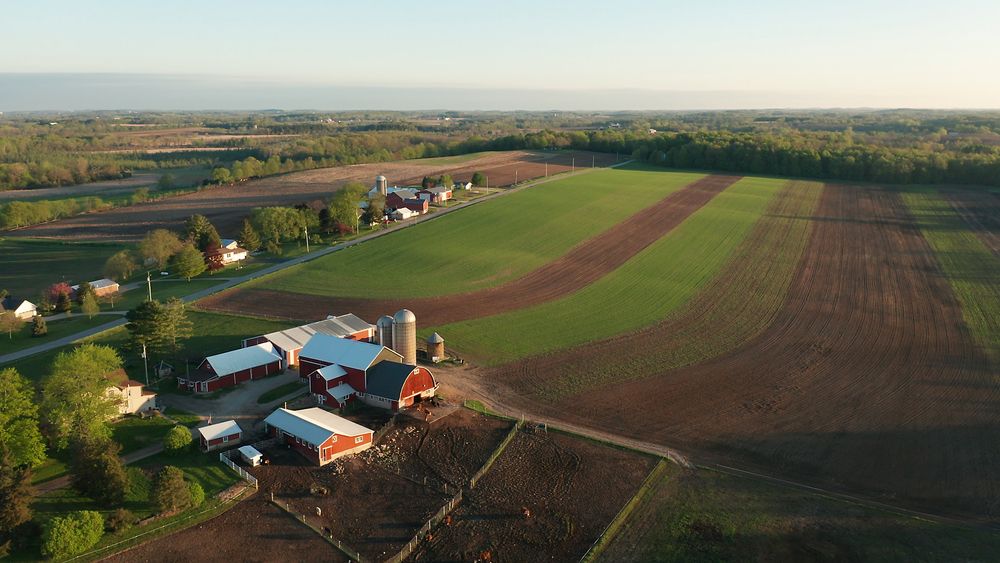 Aerial,View,Of,American,Countryside,Landscape.,Farm,,Red,Barn,,Cows.