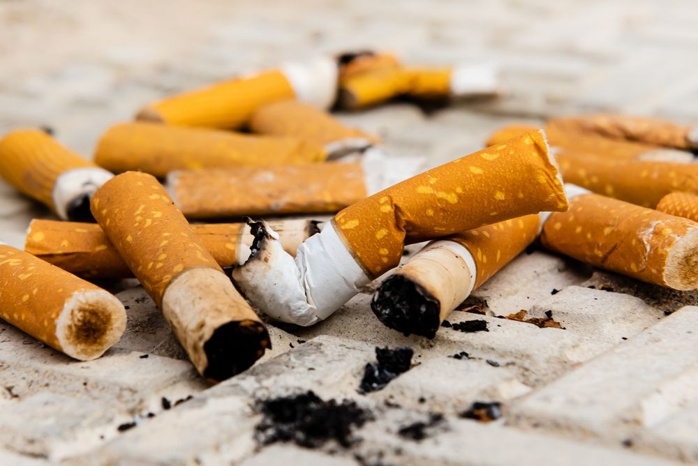Cigarette.,A,Lot,Of,Cigarette,Butts,And,Matches,Are,Lying
