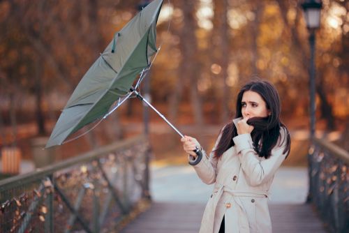 Girl,Fighting,The,Wind,Holding,Umbrella,Raining,Weather.,Autumn,Woman
