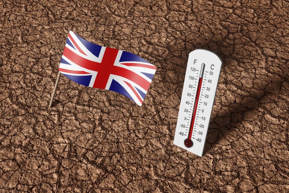 Flag,Of,The,Uk,And,A,Thermometer,On,Cracked,Earth