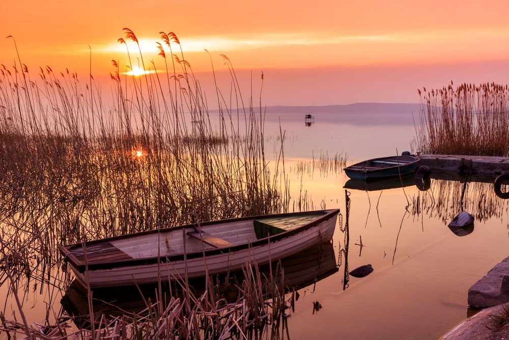 Sunset,On,The,Lake,Balaton,With,A,Boat,In,Hungary