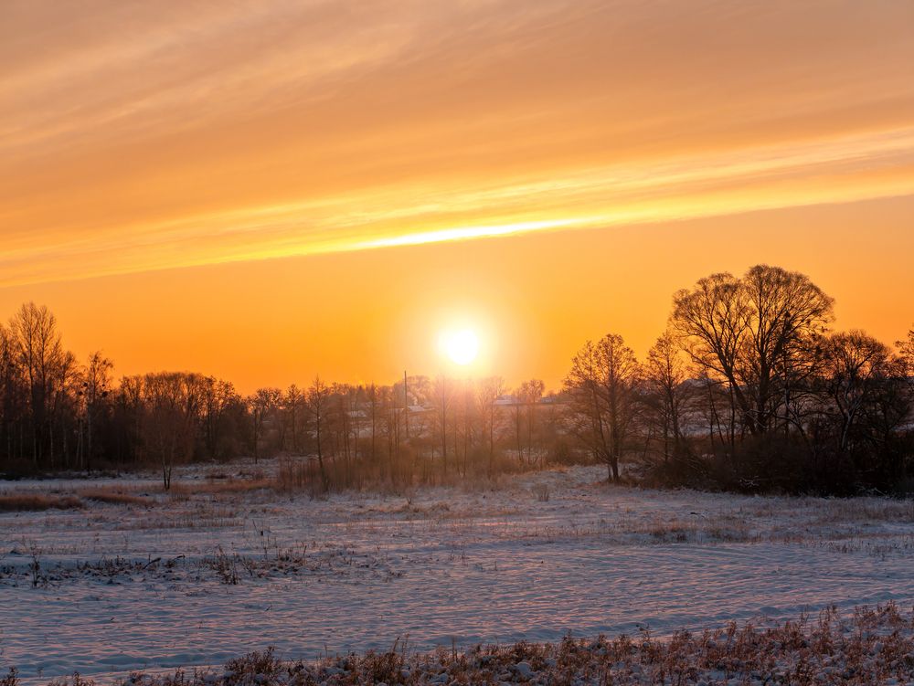 Sunny,Sunset,Over,A,Snowy,Agricultural,Field,In,Winter.,Sunrise.