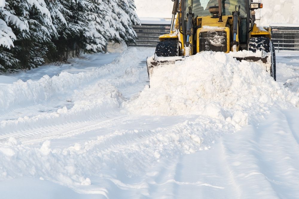Close,-,Up,Of,Snowplow,Plowing,Road,During,Storm.,Winter