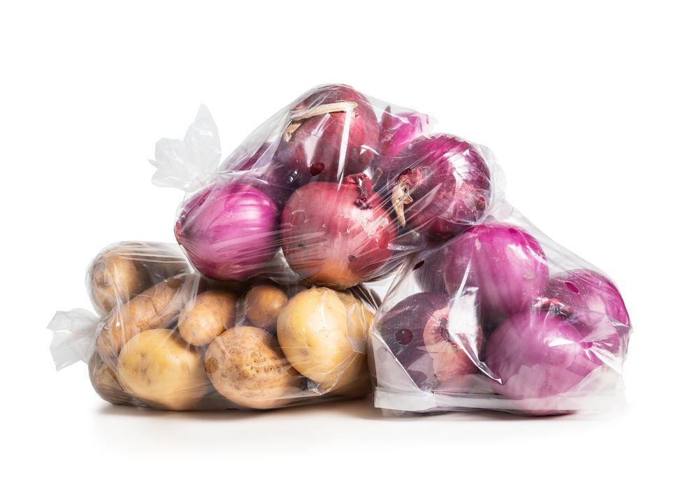 1,Dollar,Vegetable,Bags,Containing,Onions,And,Potatoes.,Blemished,Or