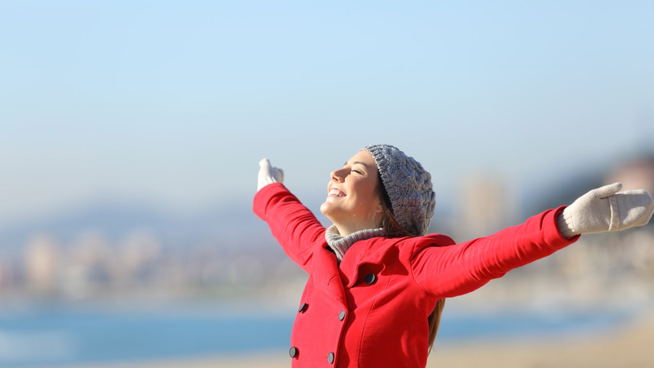 Happy,Woman,Wearing,A,Red,Jacket,Breathing,Fresh,Air,And