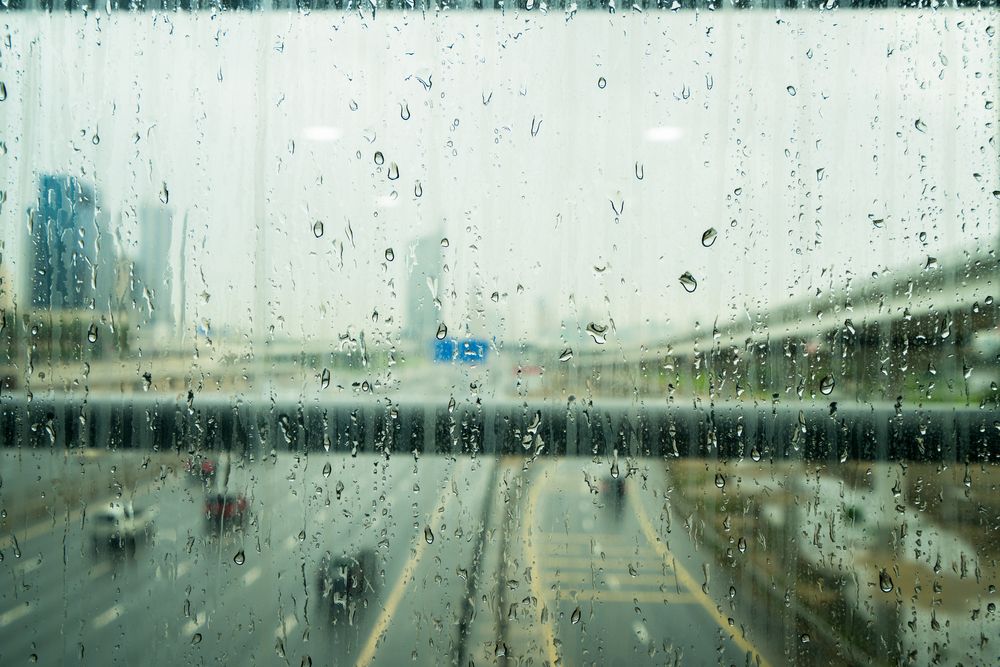 Water,Drops,On,Glass,Window,After,Heavy,Rain,In,Dubai,
