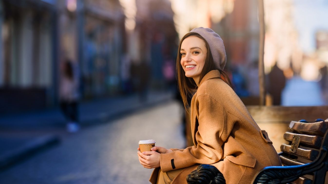 Young,Smiling,Woman,Girl,Drinking,Morning,Coffee,Resting,On,Bench.