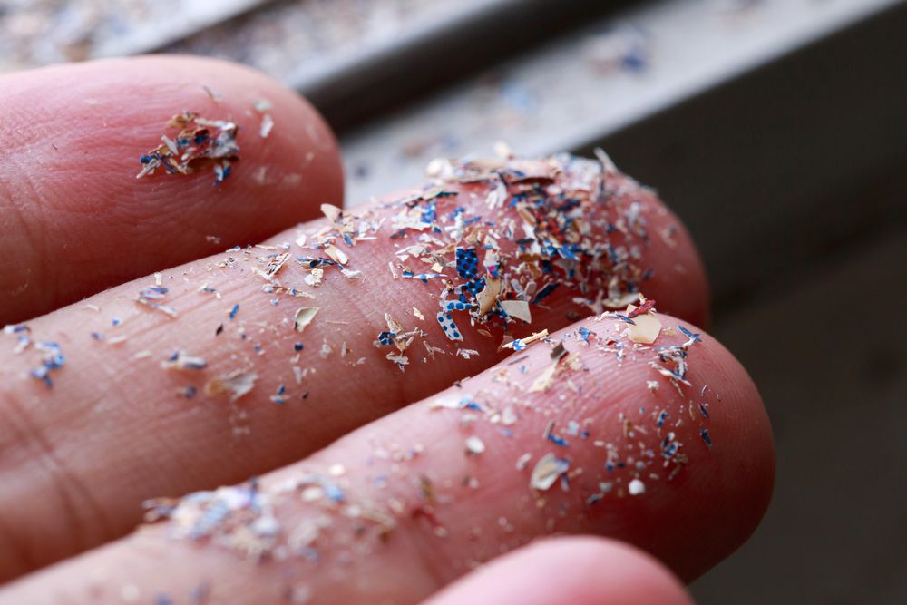 Close,Up,Side,Shot,Of,Microplastics,Lay,On,People,Hand.concept