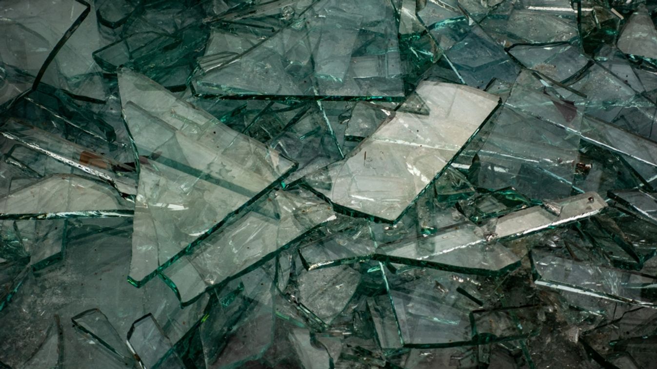 Broken,Flat,Glass,Panes,In,The,Recycling,Container