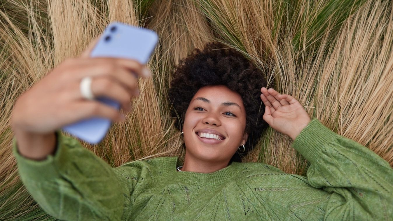 Overhead,Shot,Of,Relaxed,Afro,American,Woman,Lies,In,Long