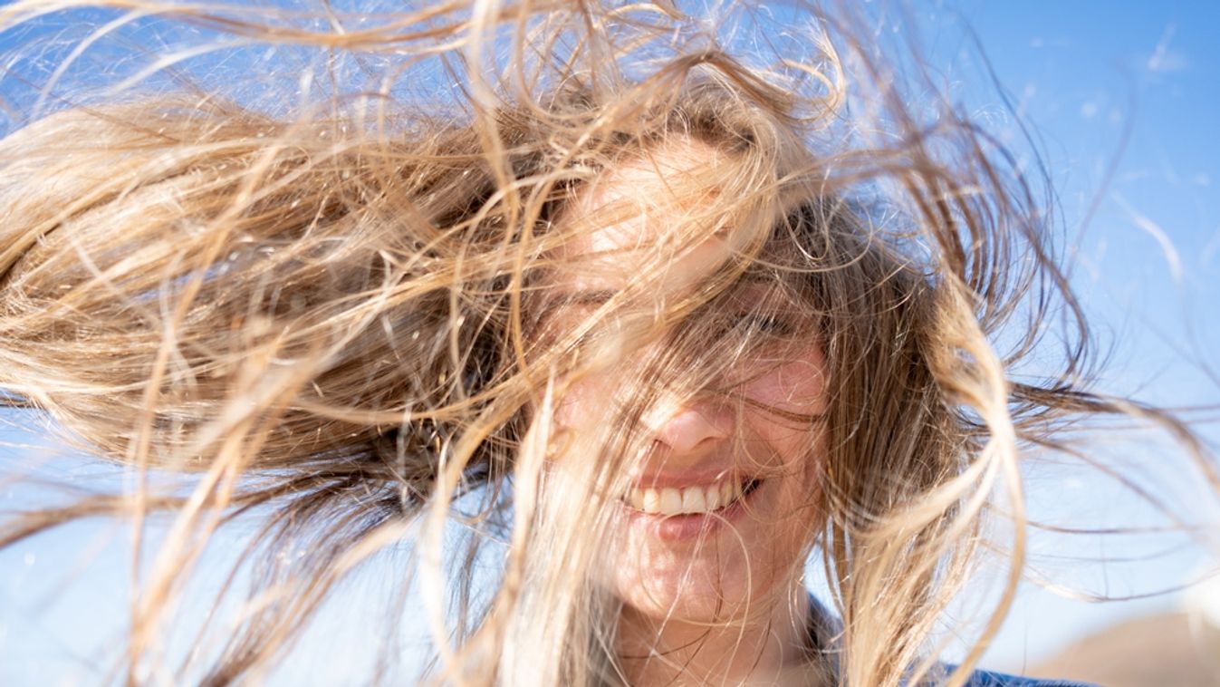 Closeup,Of,Young,Woman,Face,Covered,With,Flying,Hair,In