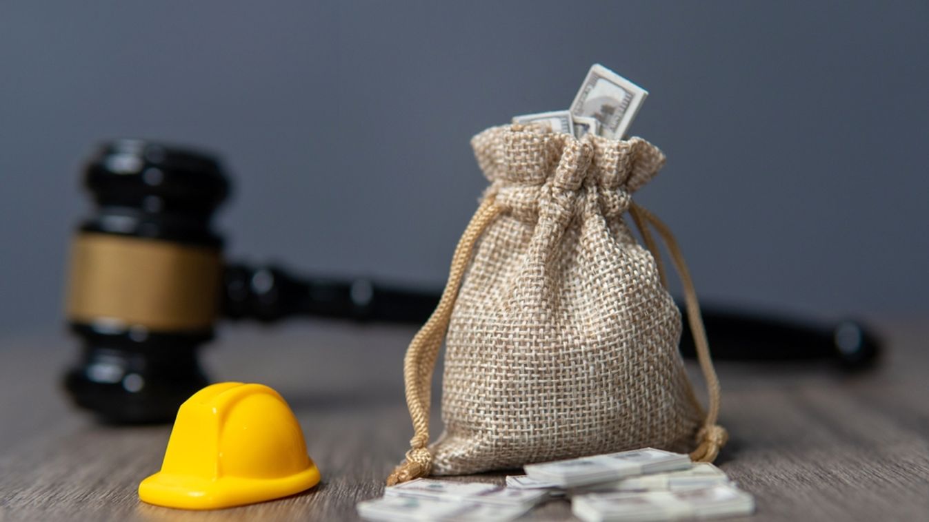 Closeup,Image,A,Bag,Of,Money,,Hard,Hat,And,Gavel