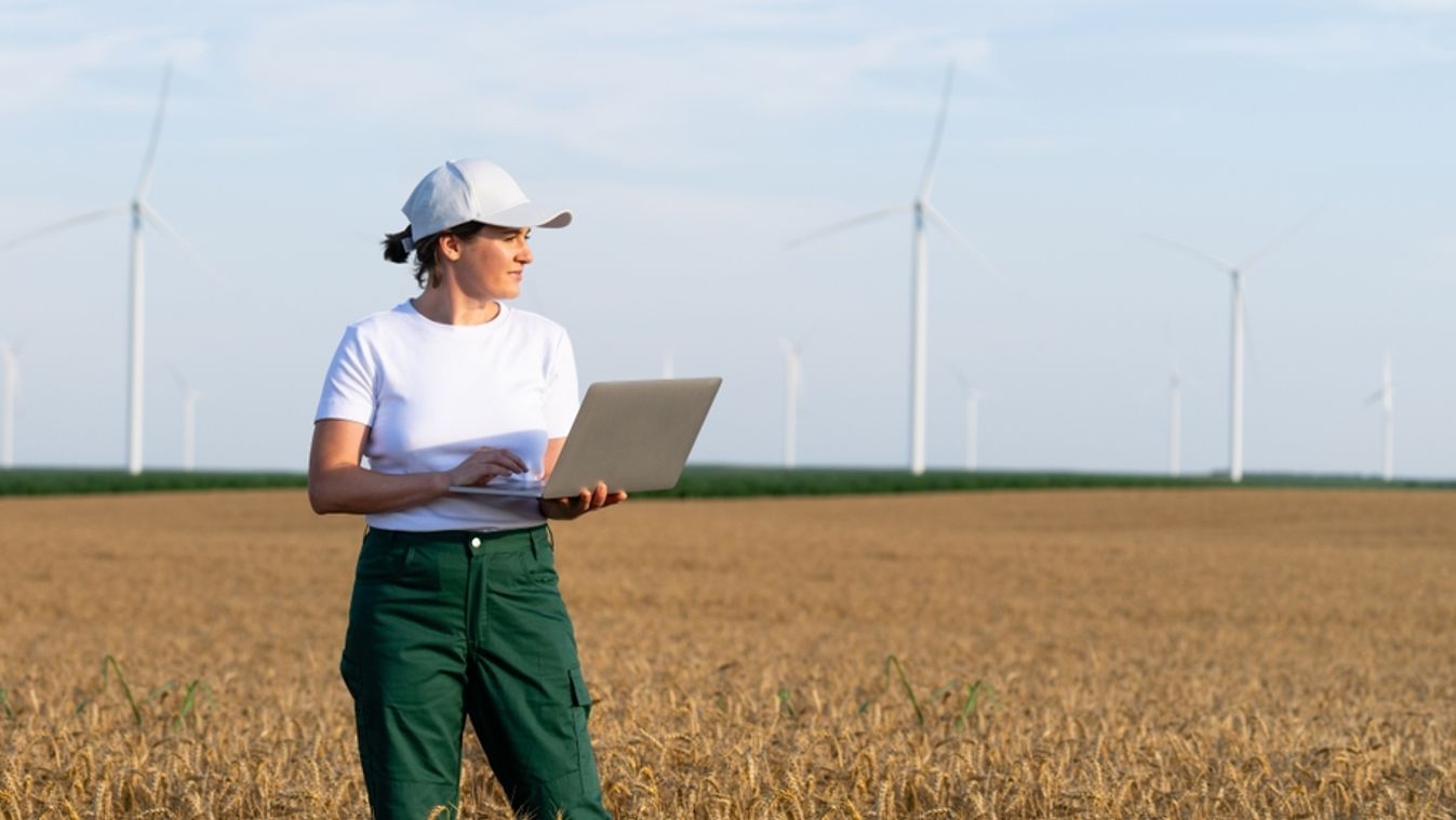 Woman,Farmer,Wearing,White,Cap,And,T-shirt,With,Laptop.,Wind