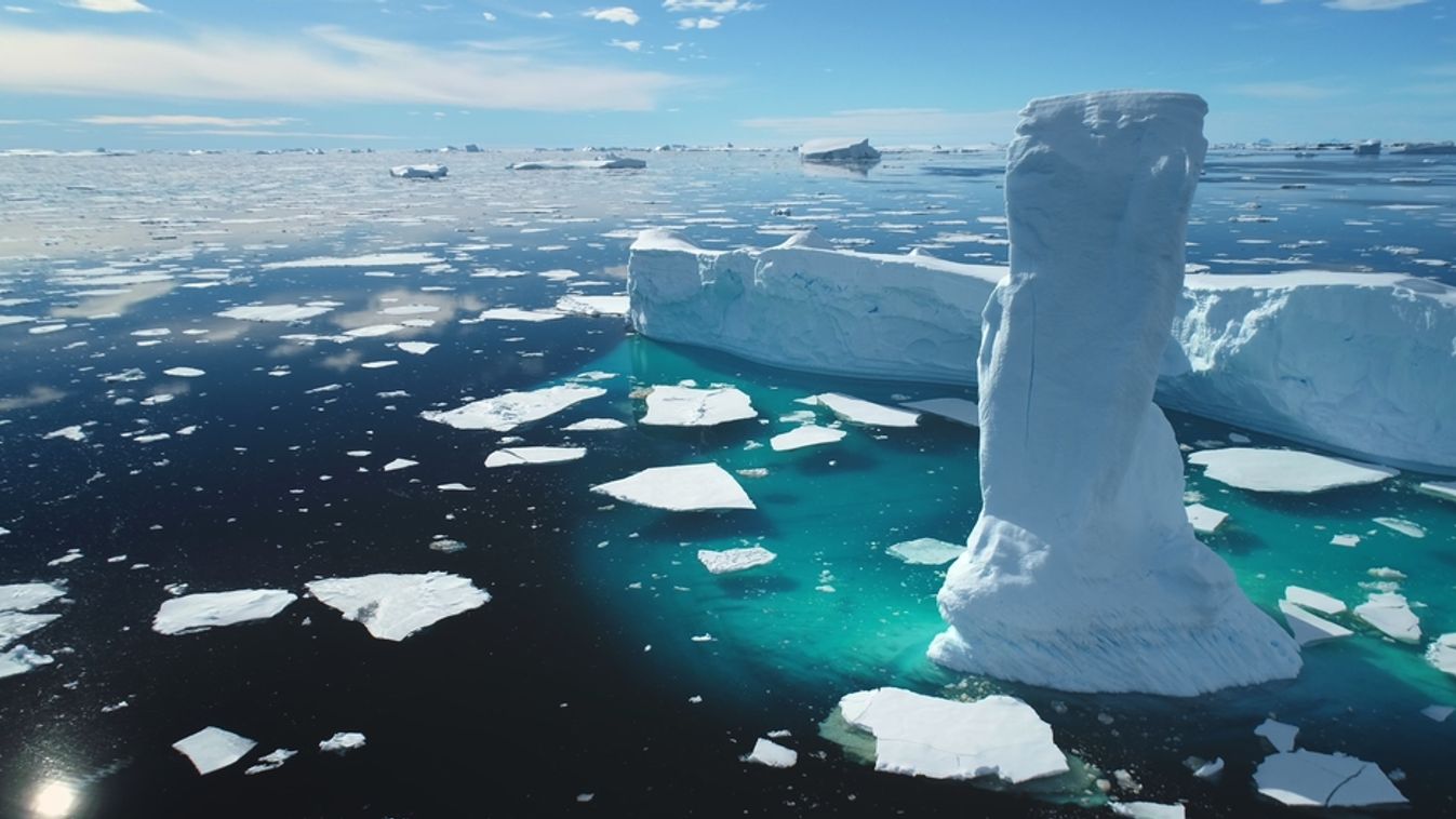 Towering,Melting,Iceberg,In,Arctic,Icy,Ocean.,Snow,Covered,Glacier