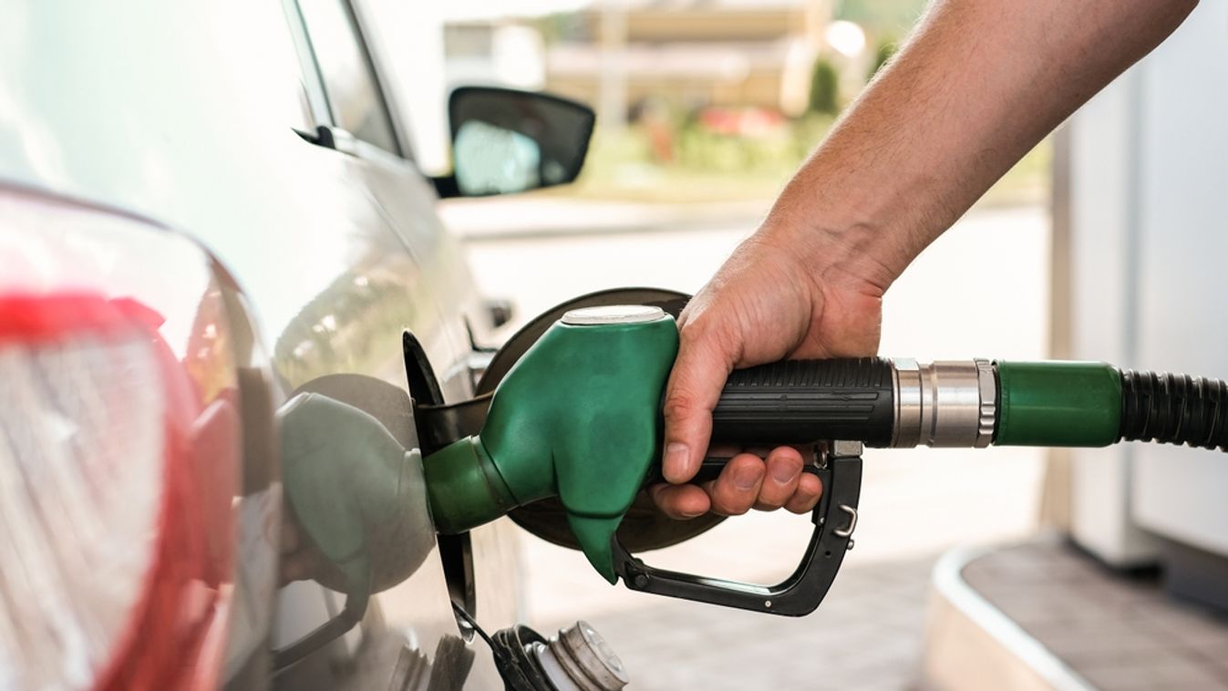 Close-up,Of,A,Hand,Refueling,A,Car,With,A,Green