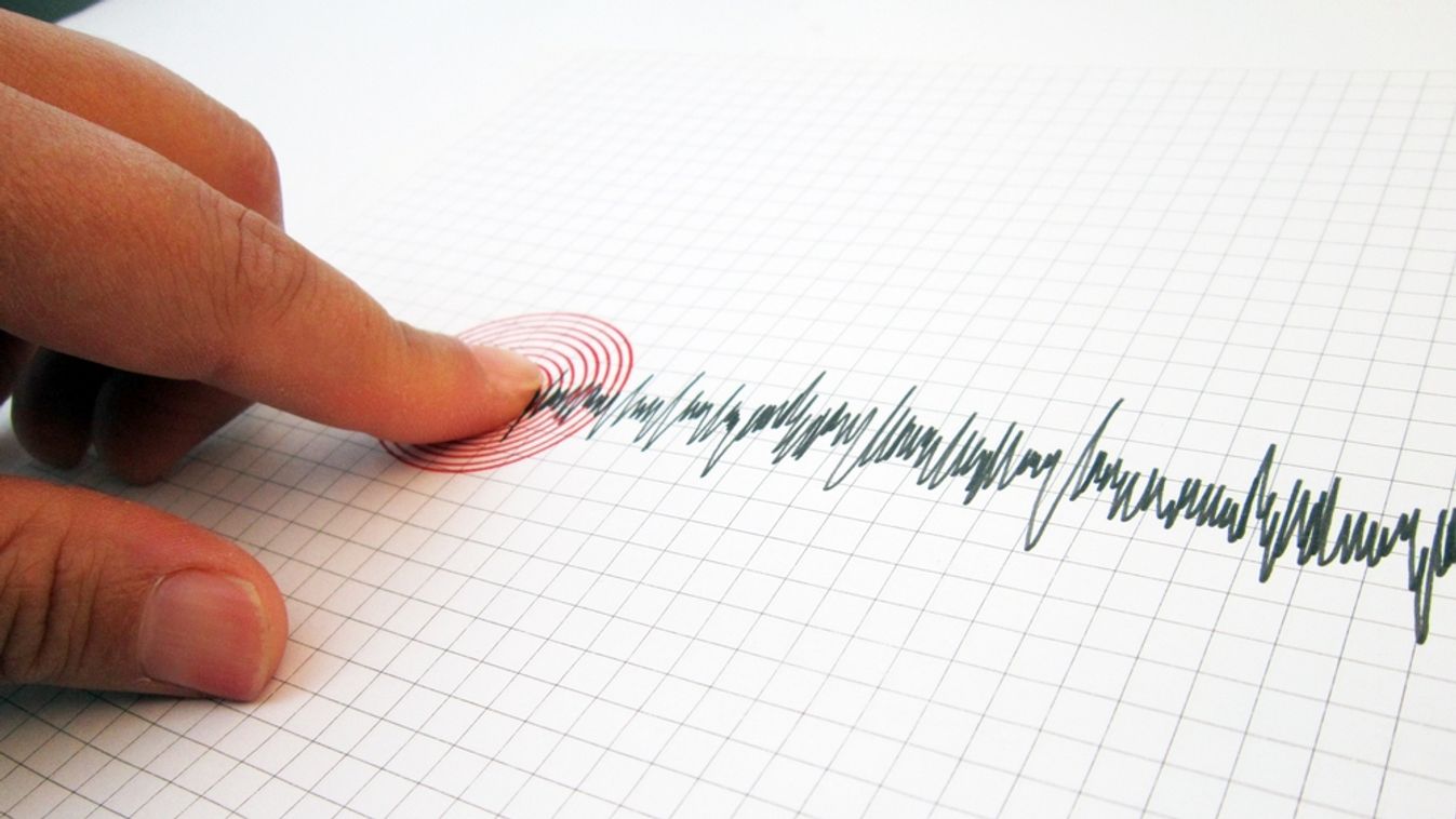 Seismograph,And,Earthquake.,A,Hand,Pointing,At,A,Seismograph,Recording