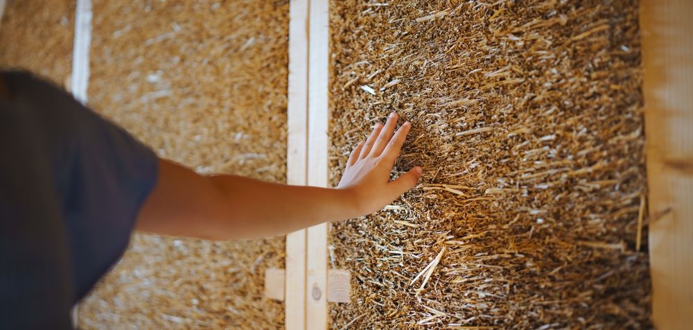 Close-up,Of,Girl,Hand,Touching,Straw,Wooden,Eco,House,Framing.